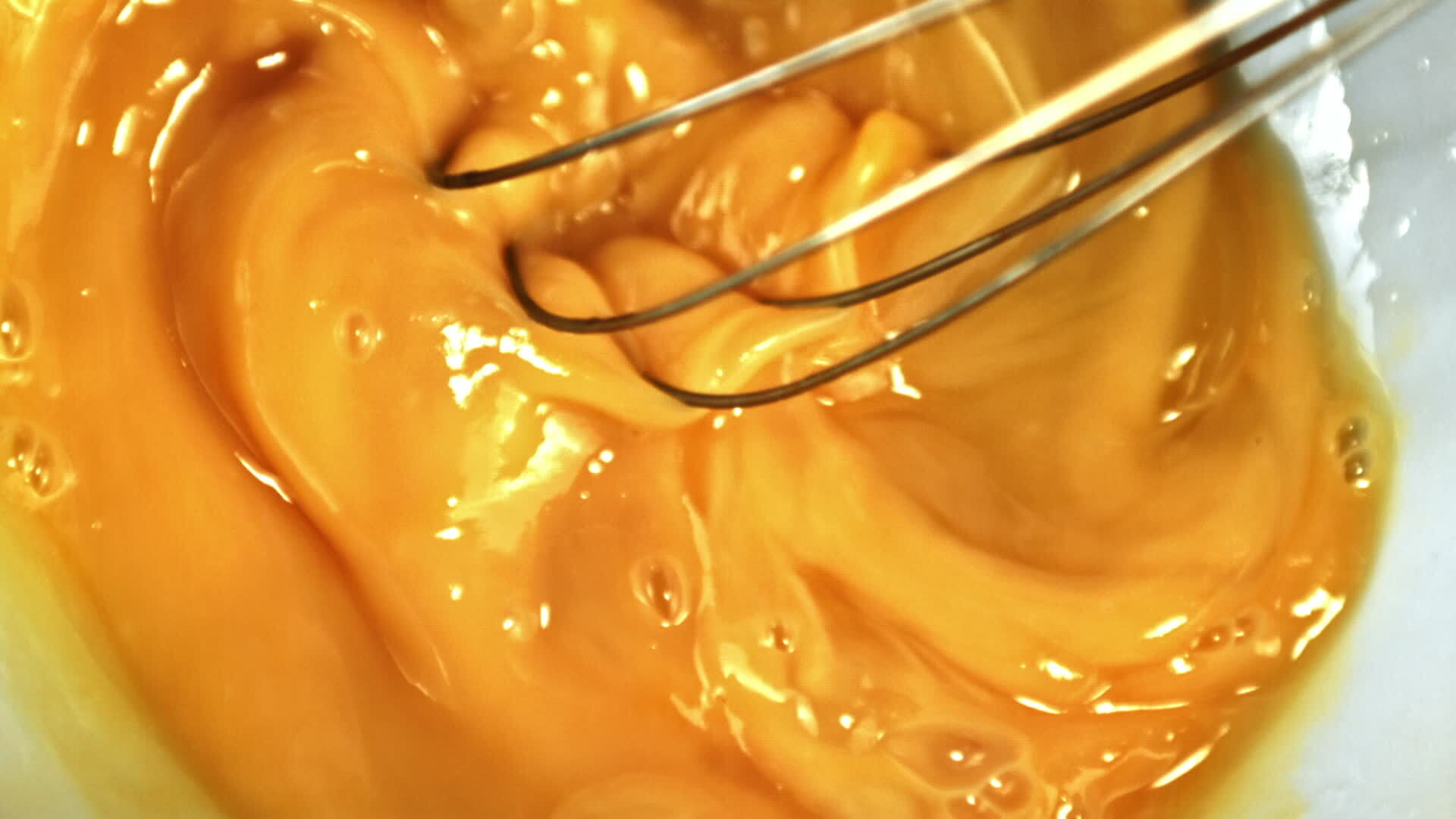Super slow motion whisk beats eggs. High quality FullHD footage