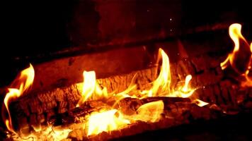 Super slow motion fireplace burns with a bright flame of firewood. High quality FullHD footage video