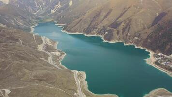 Aerial. stunningly beautiful alpine lake surrounded by majestic spring mountains video