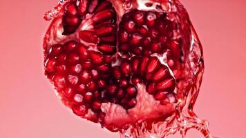 Super slow motion pomegranate seeds. High quality FullHD footage video