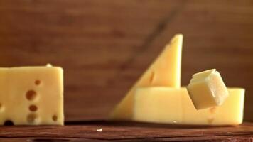 Super slow motion pieces of cheese. High quality FullHD footage video