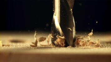 Drill wood with sawdust. Macro background. Wood texture. Filmed is slow motion 1000 fps.High quality FullHD footage video