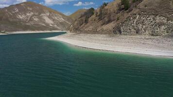 Aerial. Delight in the mesmerizing view of Kazenoy-Am alpine lake video