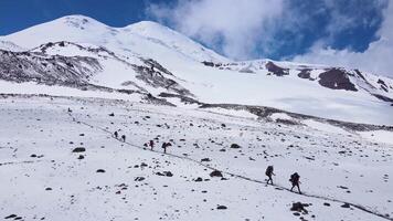 Aerial view of a group of climbers descending from the top of mount video