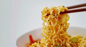 Cooked instant noodles sprinkled with spices, vegetables, herbs. photo