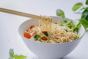 Cooked instant noodles sprinkled with spices, vegetables, herbs. photo