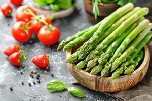 Vegetables. Green asparagus on the table. photo