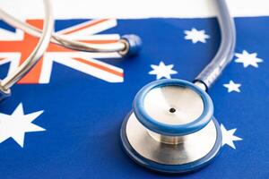 Stethoscope on Australia flag background, Business and finance concept. photo
