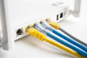 Ethernet cable with wireless router connect to internet service provider internet network. photo