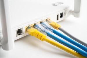 Ethernet cable with wireless router connect to internet service provider internet network. photo