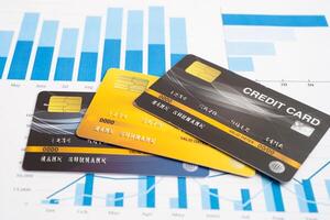 Credit card model on chart and graph spreadsheet paper. photo