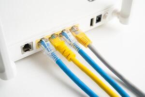 Ethernet cable with wireless router connect to internet service provider internet network. photo