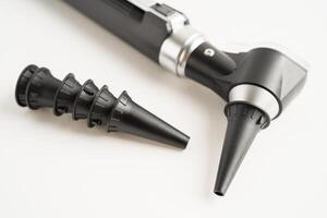 Otoscope for audiologist or ENT doctor use otoscope checking ear and treate hearing loss problem. photo