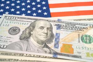 US dollar banknotes on USA America flag background, Business and finance. photo