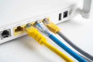Ethernet cable with wireless router connect to internet service provider internet network. photo