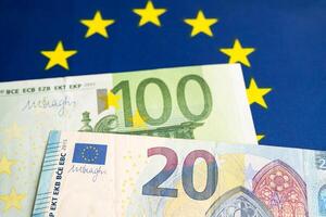 Euro banknotes on flag, Business and finance concept. photo