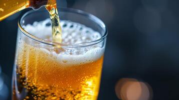 Pouring beer into glass photo