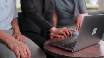 Asian businessman, entrepreneur training businesswoman working confidently together at office Manager and employees talking and using laptop computers. Three people. Business concept. video