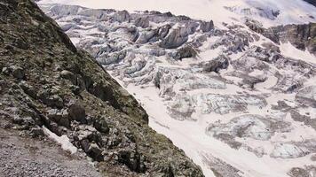 Beautiful cinematic aerial view of the icefall on the Mizhirgi Glacier video