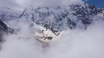 Breathtaking mountain scenery of snow-covered alpine peaks Aerial view video