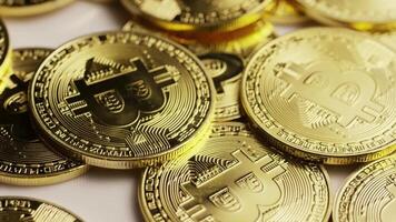 Golden bitcoin coins slowly spinning 4k Background video