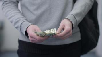 Man anxiously counting dollar bills 4k Background video