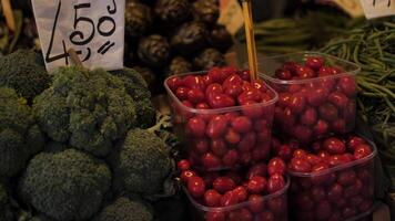 Tomatoes and broccoli in a greengrocer 4k background video