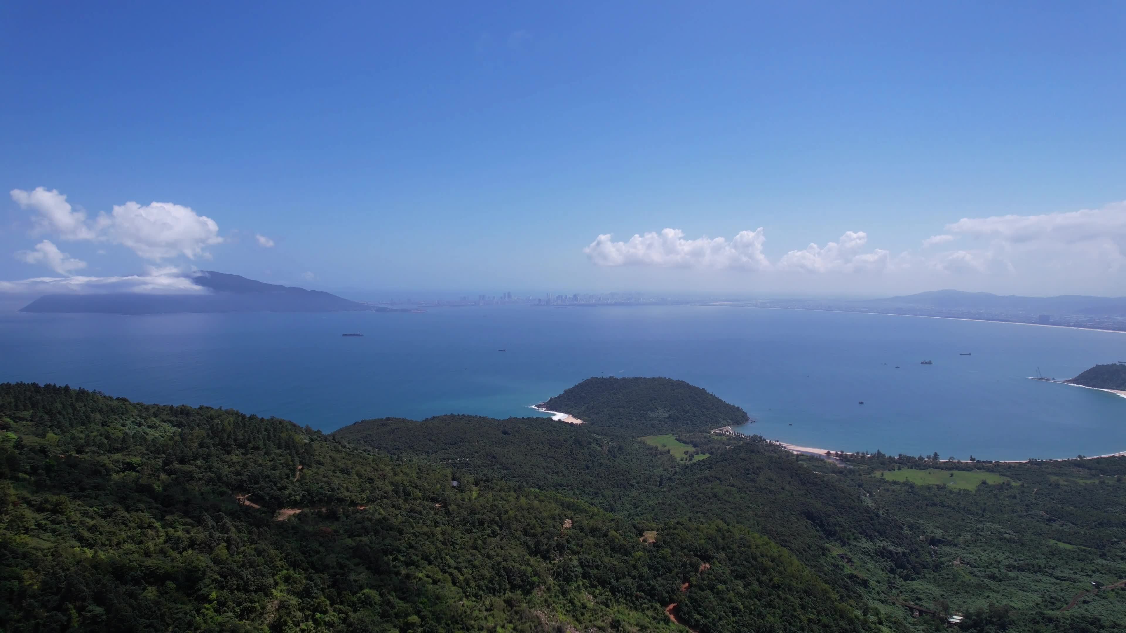Aerial view showcasing the breathtaking coastline with lush greenery 