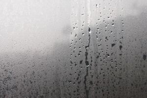 Water droplets from steam on the glass surface photo