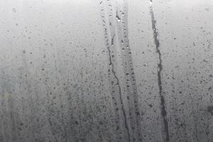 Water droplets from steam on the glass surface photo