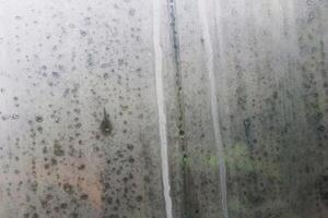 Water droplets from steam on the glass surface photo