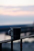 Morning Close-Up Tea in Mug, Sunrise Bokeh Overlooking Harbour Views in Taiwan photo