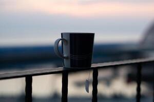 Golden Horizons, Close-Up Mug Sunrise Bokeh Overlooking Ocean Views in Taiwan photo