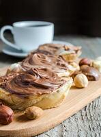 Slices of bread with chocolate cream and nuts photo