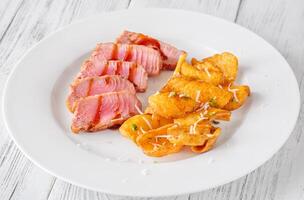 Tuna with potato dippers photo