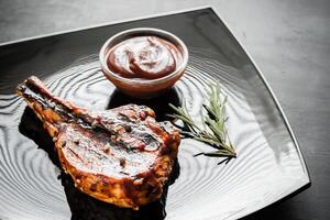 Grilled pork ribs on the plate photo