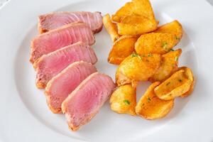 Tuna with potato dippers photo