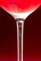 Wineglass with cold red wine photo