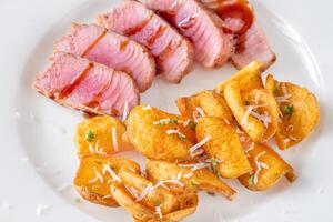 Tuna with potato dippers photo