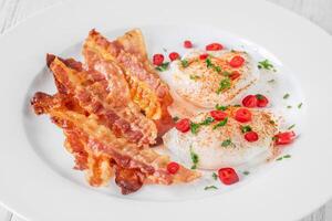Poached eggs with bacon photo
