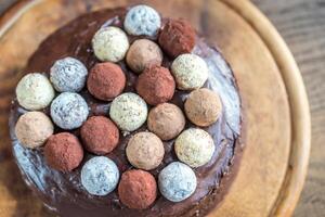 Sacher torte decorated with truffles photo