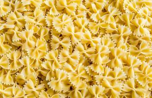 Uncooked farfalle pasta background photo