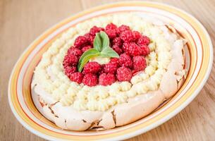 Pavlova meringue with raspberries photo