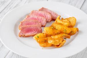 Tuna with potato dippers photo