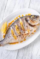 Baked dorado fish photo