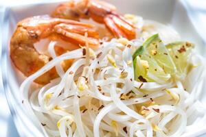 Rice noodles with shrimps and bean sprouts photo