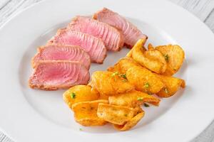 Tuna with potato dippers photo