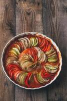 Dish of ratatouille on the wooden table photo