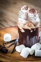 Two mugs of hot chocolate with marshmallows photo