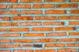 arrangement of red brick walls laid out using cement photo